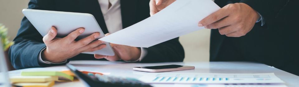 investors shuffling paper