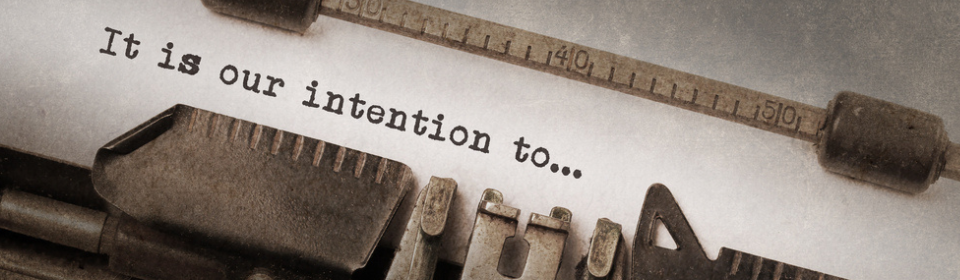 typewriter writing "it is our intention to..."